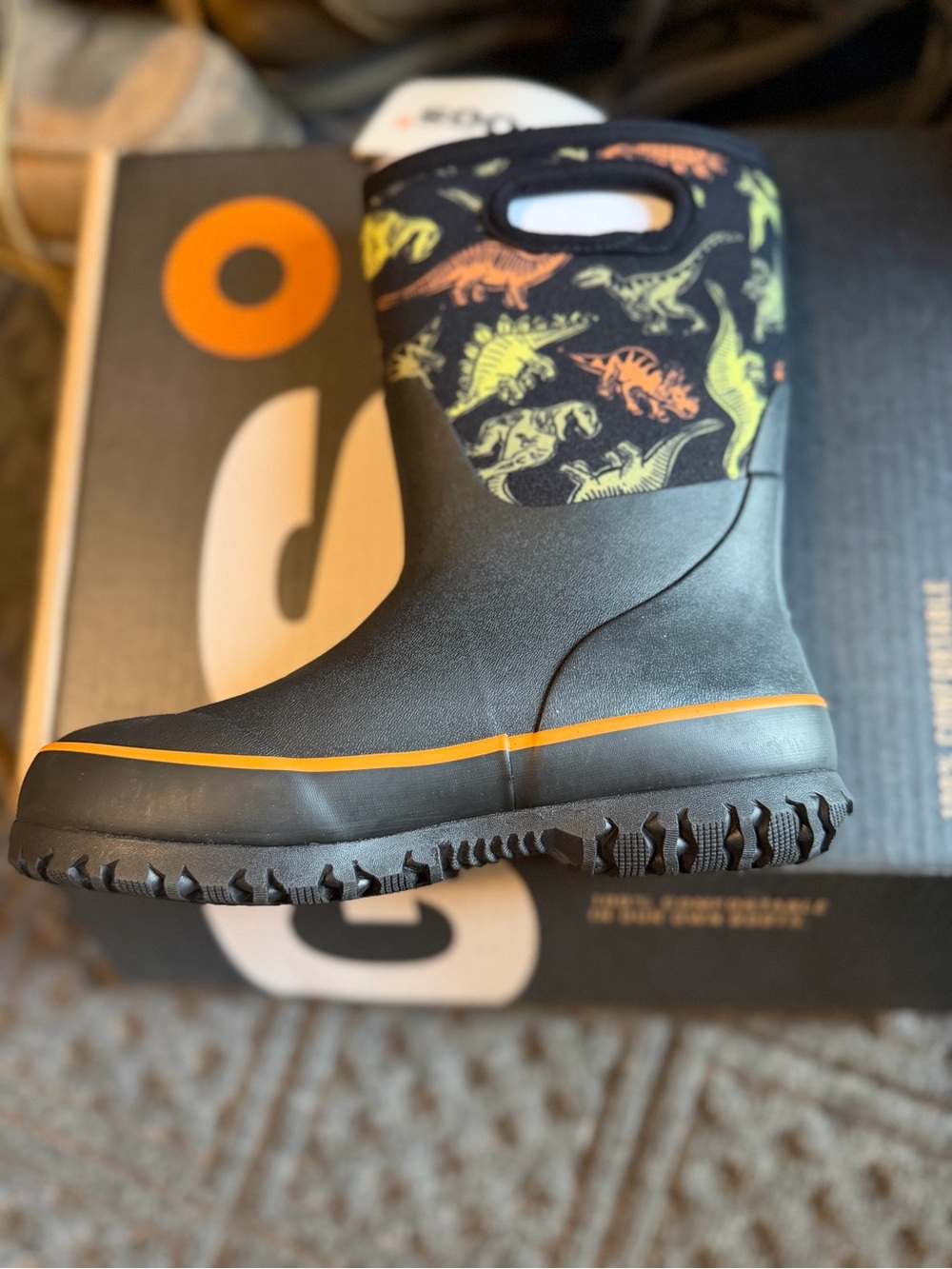 Bogs Kids Black Rain Boots with Orange Trim and Multicolor Dinosaur Print
